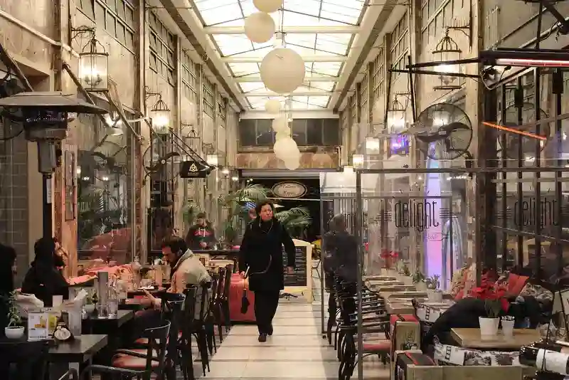 A walkway runs between the restaurants on both sides, symbolizing the restaurants in San Antonio.